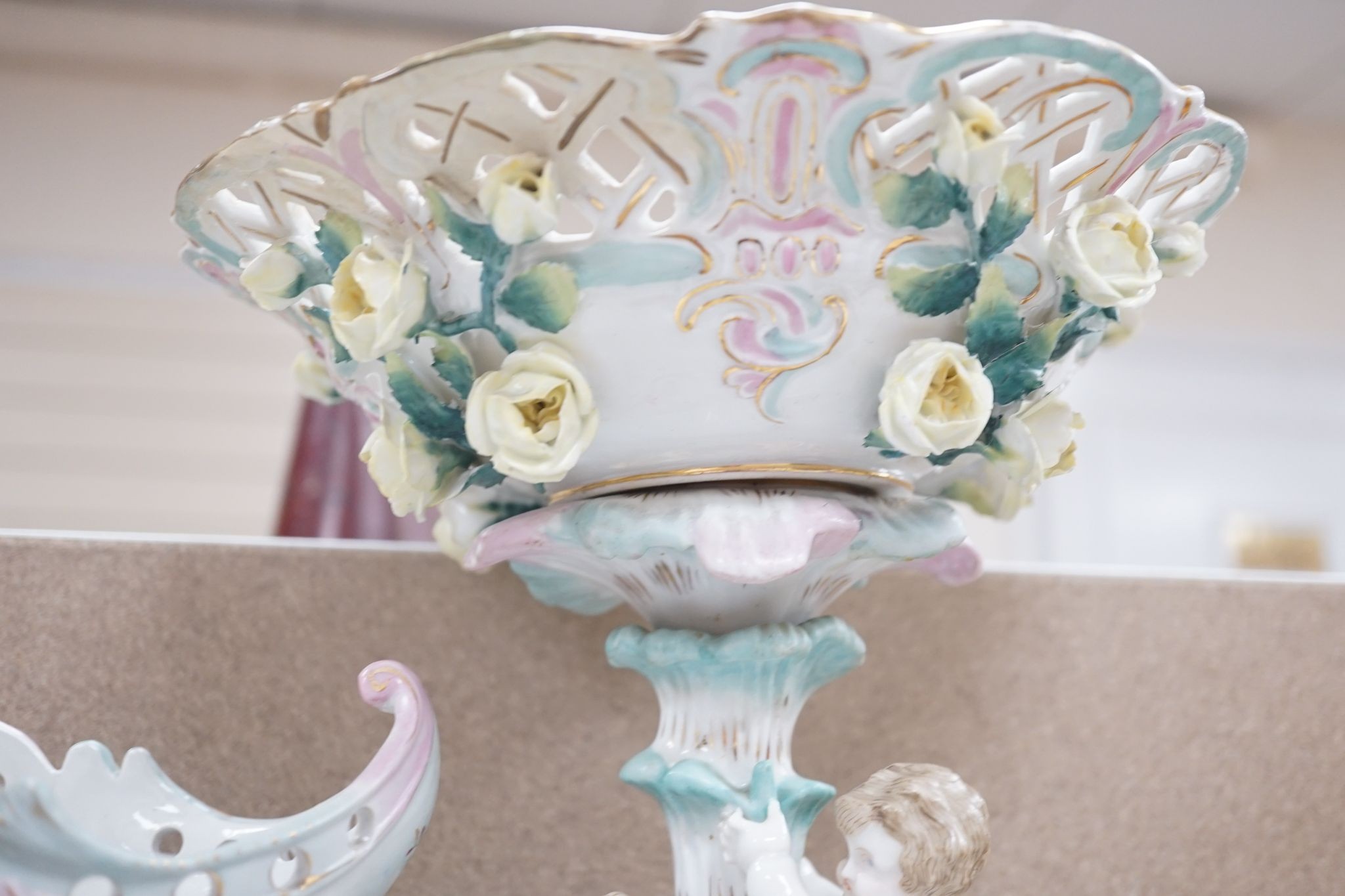 A tall German porcelain figural centrepiece bowl and two others smaller. Tallest 47cm